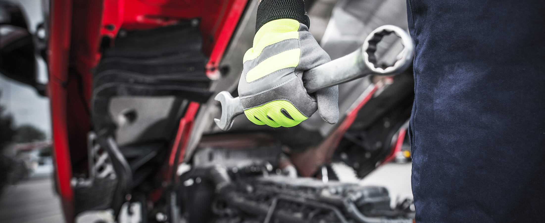 Heavy truck mechanic carrying and oversized wrench